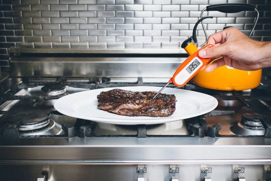 Lavatools PT12 Javelin Digital Instant Read Meat Thermometer testing a steak.
